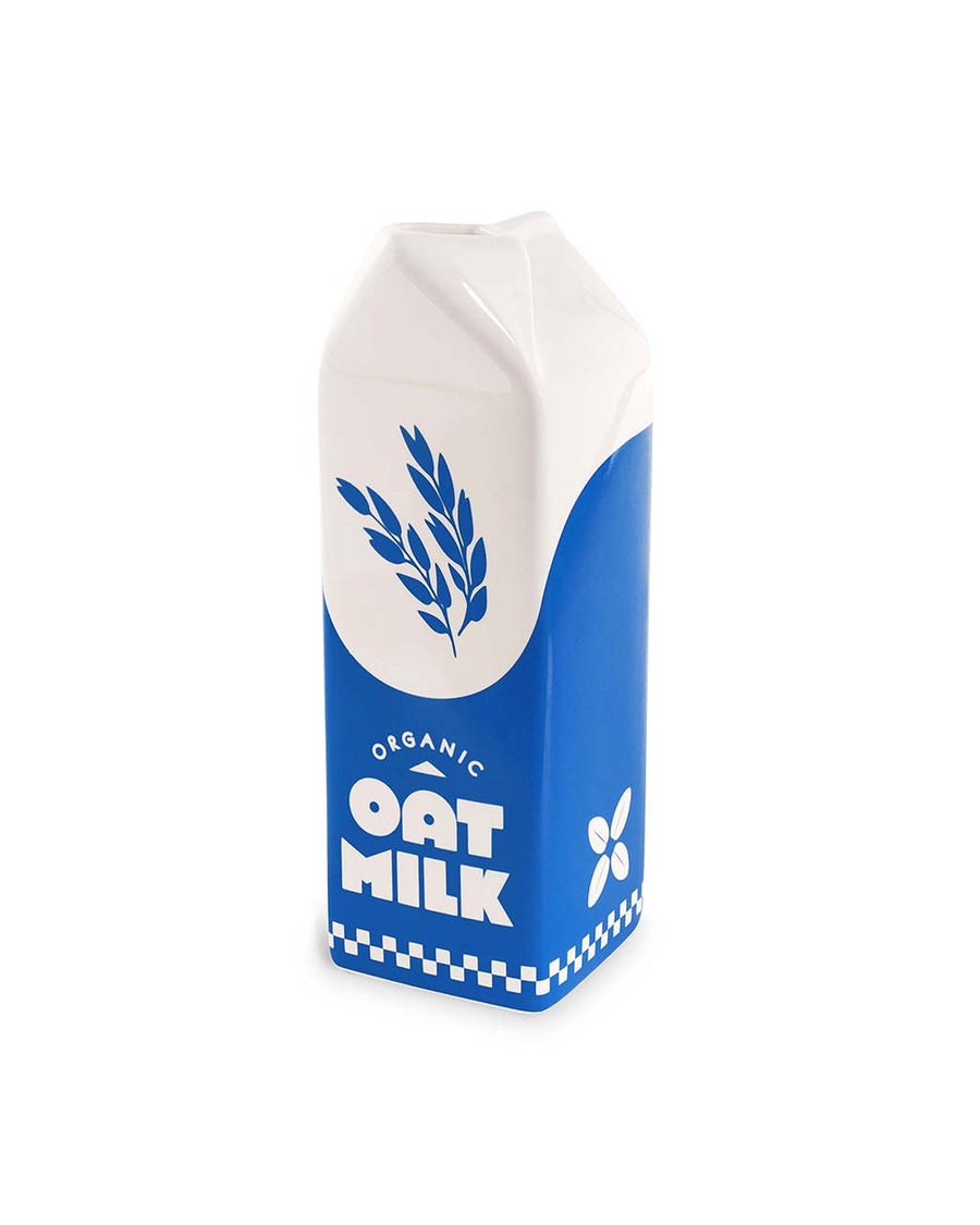 side view of white and blue carton shaped ceramic vase with 'organic oat milk' across the front