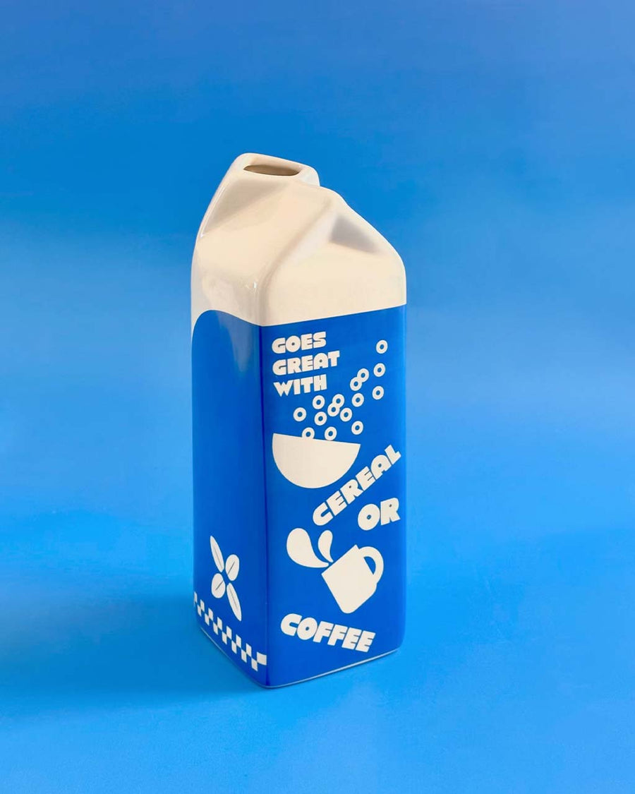 back view of oat milk vase that says 'goes great with cereal or coffee'