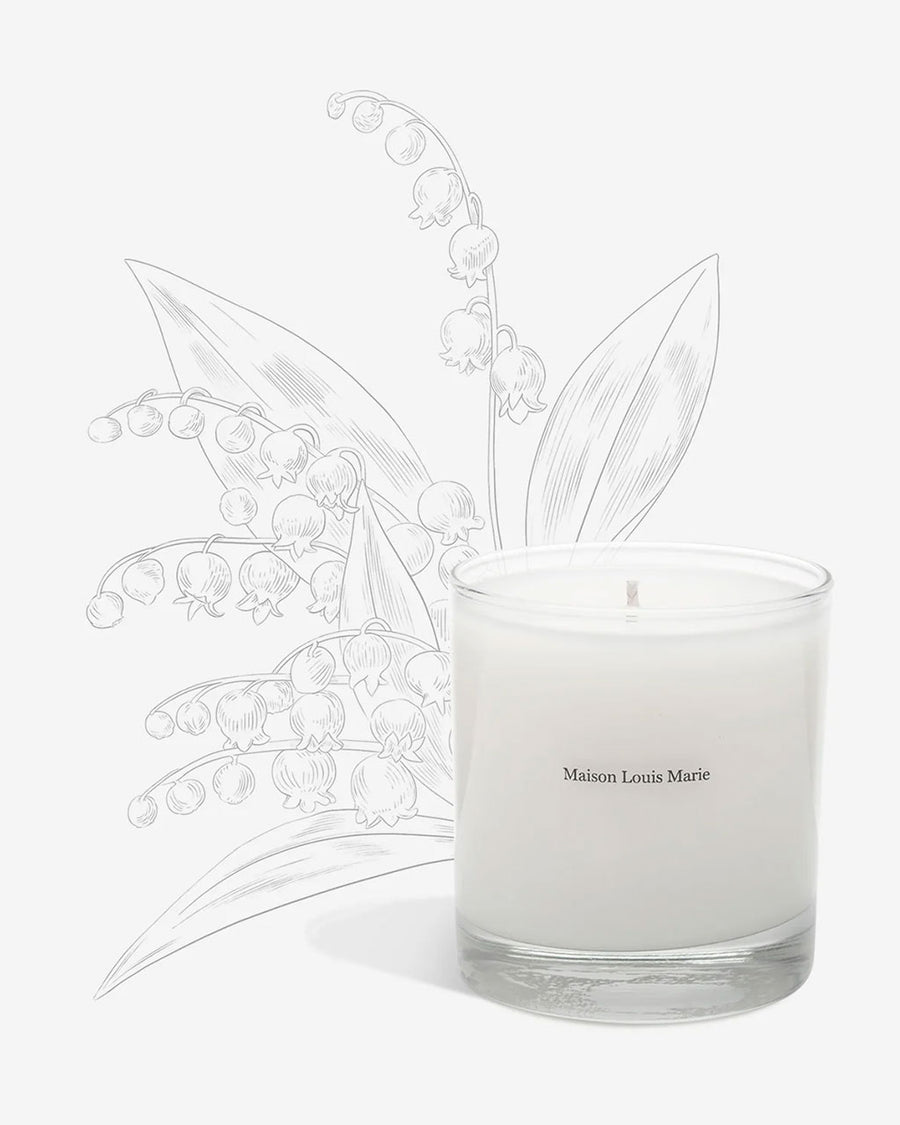 The Nouvelle Vague candle by Maison Louis Marie is white and comes in a clear glass tumbler.