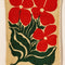 tan terry cloth towel with large orange abstract flowers