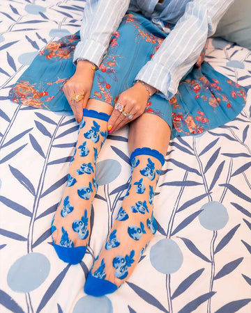 model wearing blue blueberry sheer socks