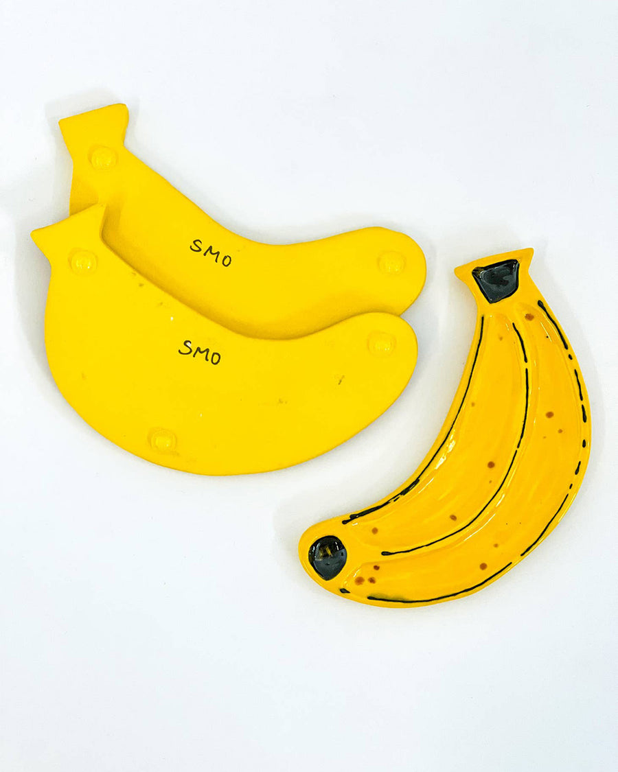 front and bottom view of banana shaped trinket dish