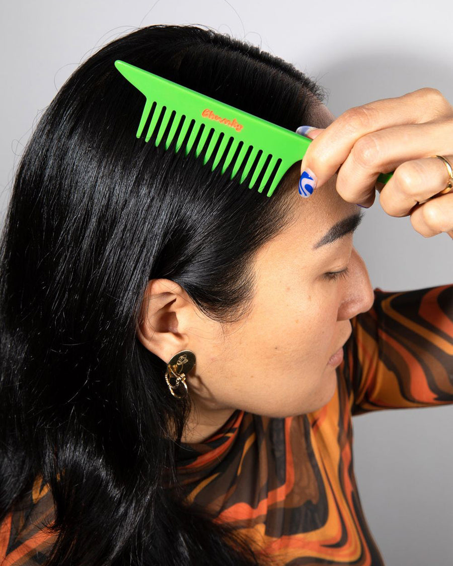 model using lime green pintail comb