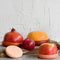 set of five terracotta toned food huggers in various fruits