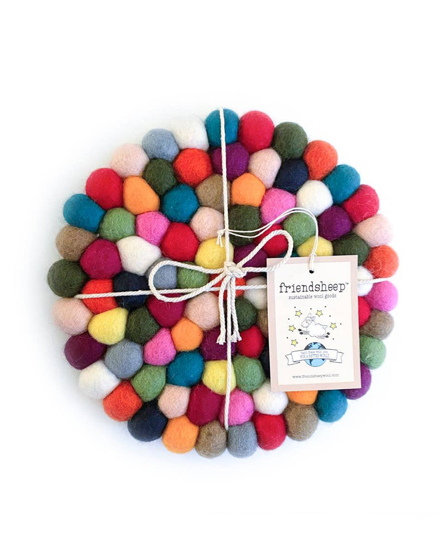 colorful pom trivet with twine and friendsheep label