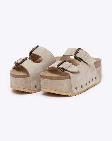 platform suede slide sandals with thick straps and metal buckle closures in taupe