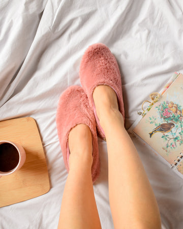 pink ballerina slipper with open notebook and tray with a cup of coffee