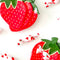 image of strawberry dishes holding pieces of candy