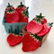 strawberry dishes in cardboard strawberry containers