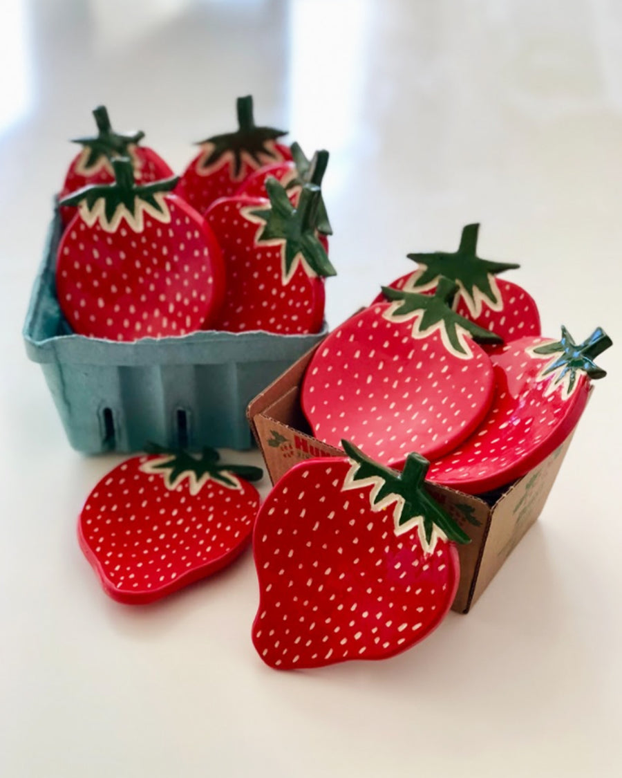 strawberry dishes in cardboard strawberry containers