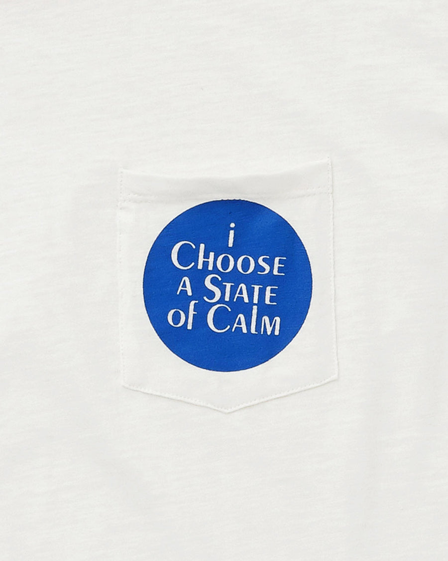close up image of patch pocket featuring a blue circle design and the words i choose a state of calm