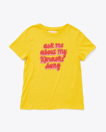bright yellow tee with the words ask me about my karaoke song in red and pink lettering
