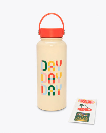 ivory stainless steel water bottle with red lid and top handle with "DAY BY DAY BY DAY" multicolor text graphic on front and sticker strip on the side