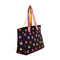 sideview of go go work bag with black ground, colorful starburst print and two sides pink/yellow straps