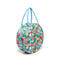side view circle bag with blue ground and all over abstract fruit print