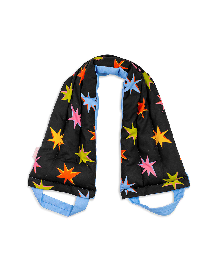 weighted neck wrap with black ground, light blue straps and colorful starburst print