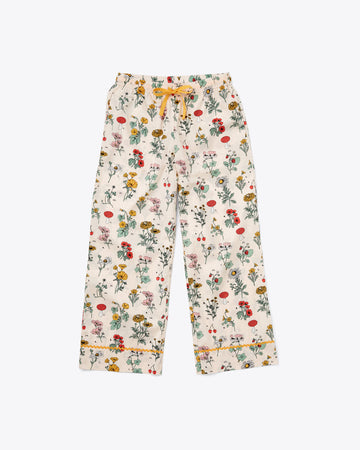long pajama pants in botanical floral pattern and yellow tie waist and ricrac ankle detail