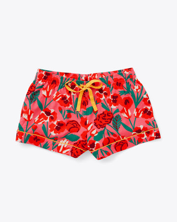 pajama shorts in red and pink bold floral print with yellow tie waist and piping detail