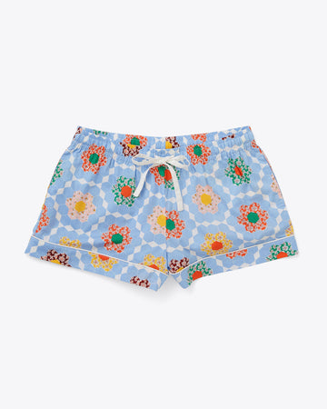 pajama shorts in blue patchwork quilt pattern with white tie waist and piping detail