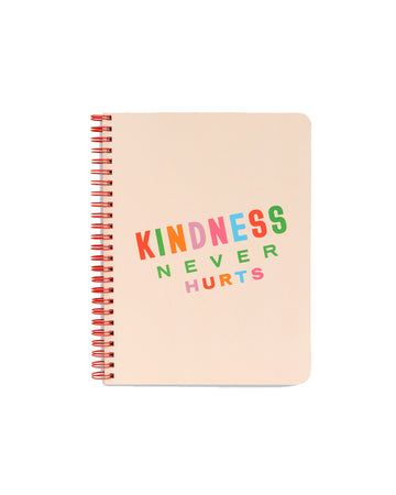 cream rough draft mini notebook with cream ground and multicolor 'kindness never hurts' across the center