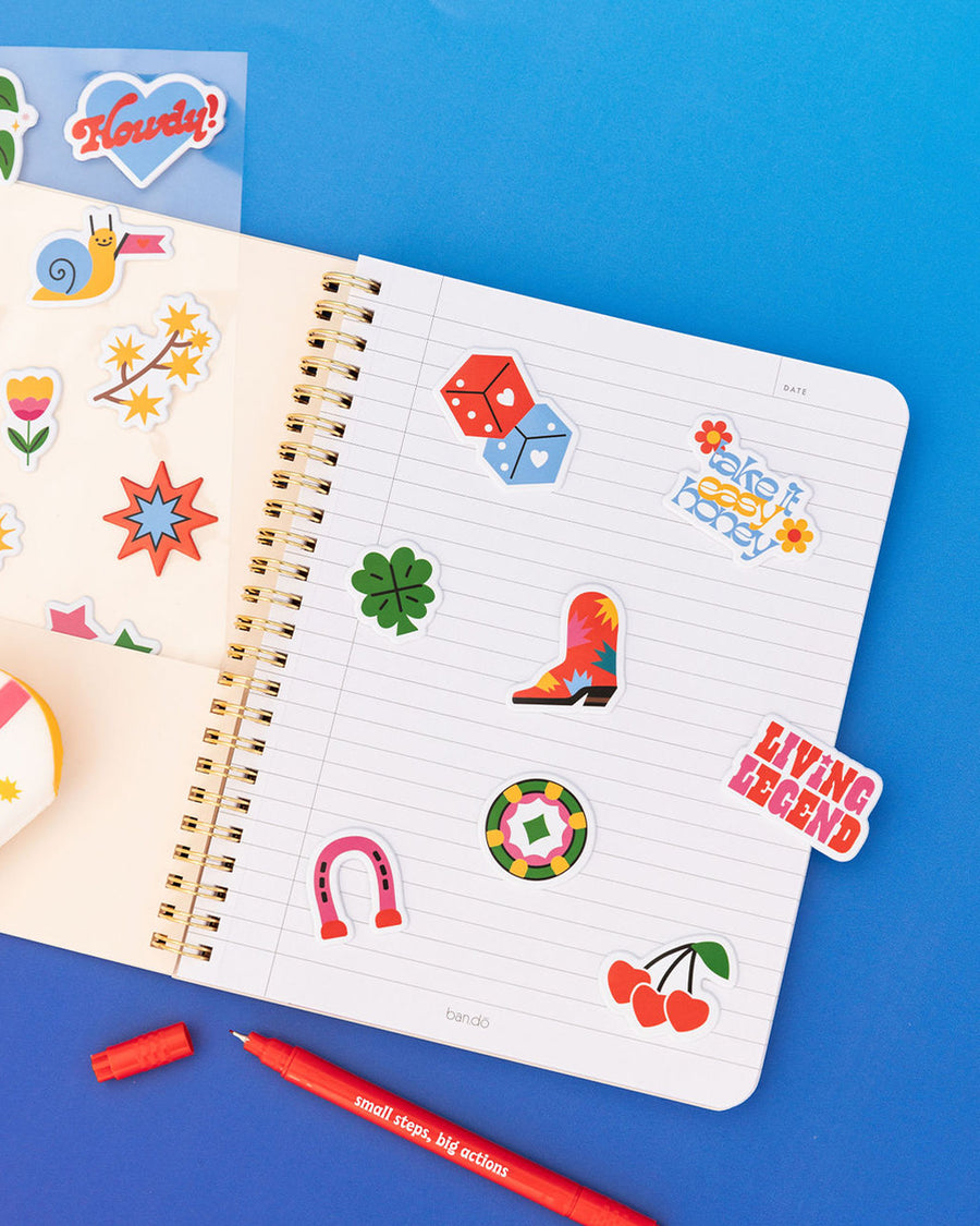 editorial image of set of 5 sheets of assorted puffy stickers in notebook