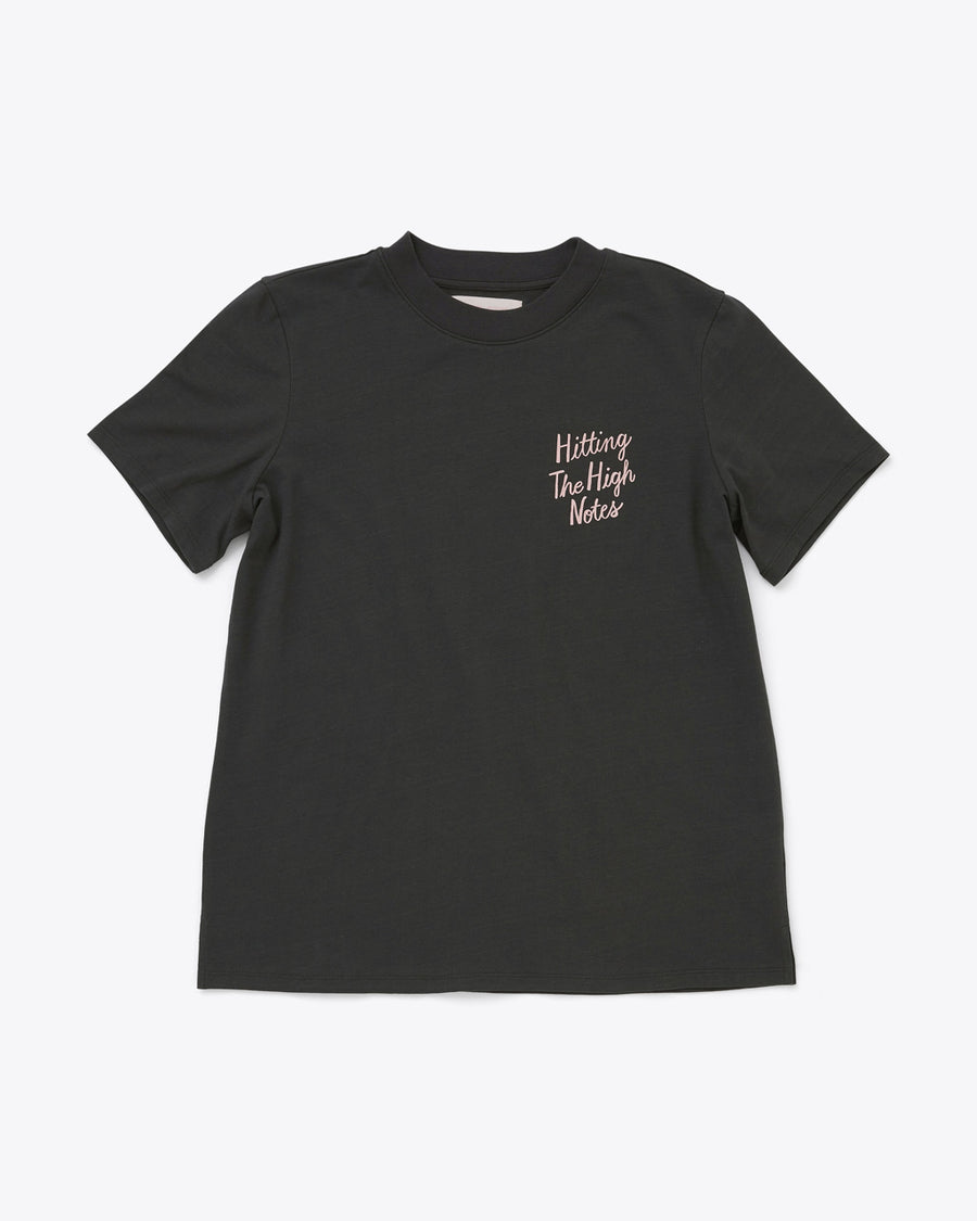 black tee with the words hitting the high notes on the left corner