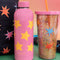 up close of pink stainless steel water bottle with yellow stars