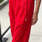 up close of model wearing red cotton balloon pants