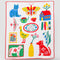 white quilted blanket with colorful icons and 'i'd rather be home reading' text in the center