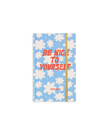 classic 17-month planner with blue ground, white flowers and red 'be nice to yourself' text across the front