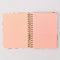 pink interior pages of pink folk floral 17-month planner with green elastic closure