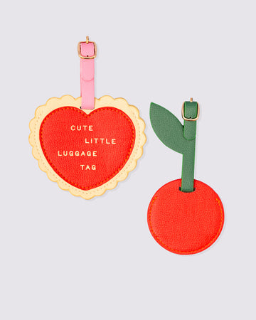 Set of 2 vegan leather luggage tags, cherry and heart shapes with buckle straps.