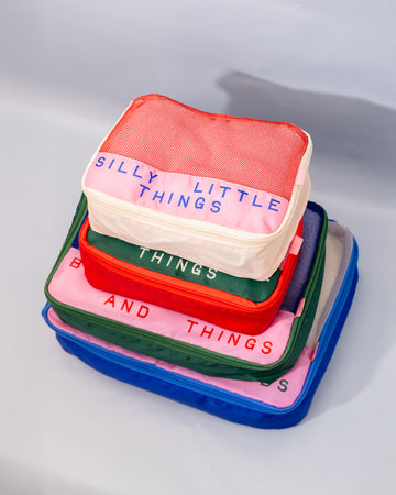 stacked set of 4 packing cubes: silly little things, sweet little things, bobs and things, and bits and bobs