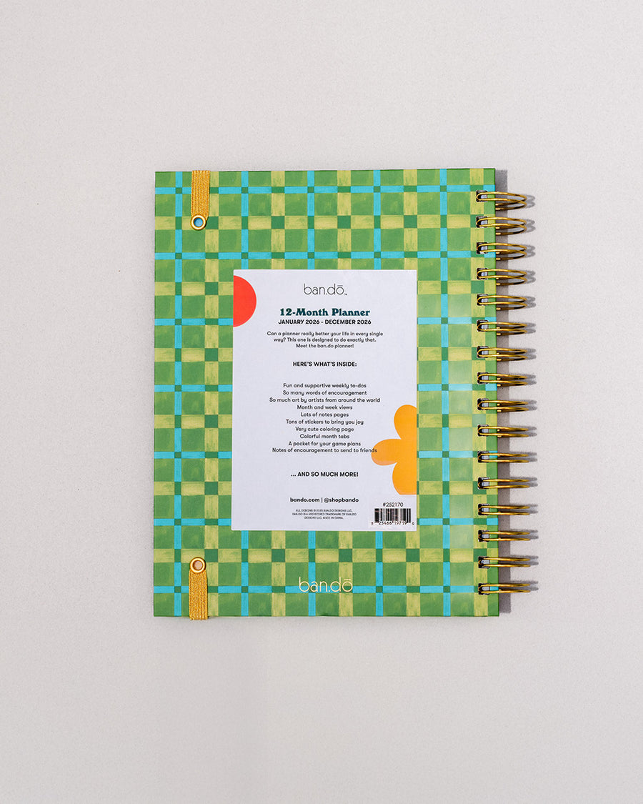back view of green, blue and yellow plaid 12-month large planner with golden yellow elastic closure