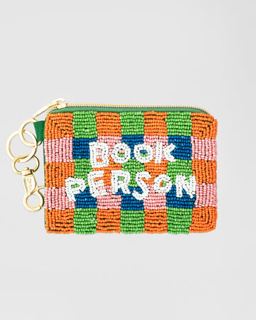 colorful checkered beaded coin pouch with white beaded 'book person' and removable gold hardware