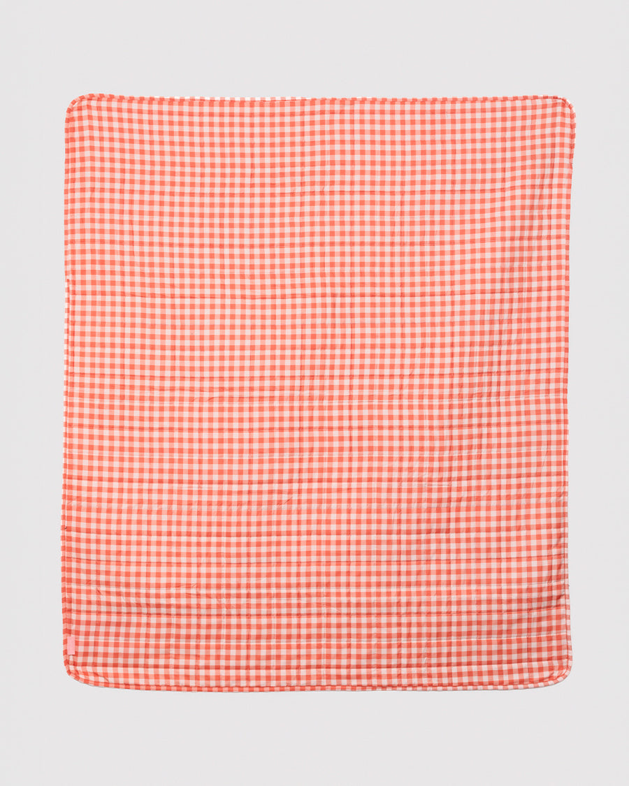 orange and gingham back of blanket