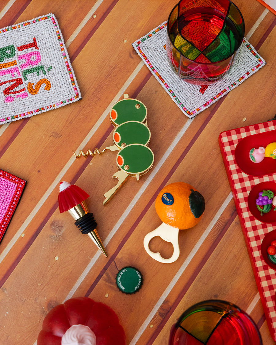 realistic orange clementine bottom opener on a table