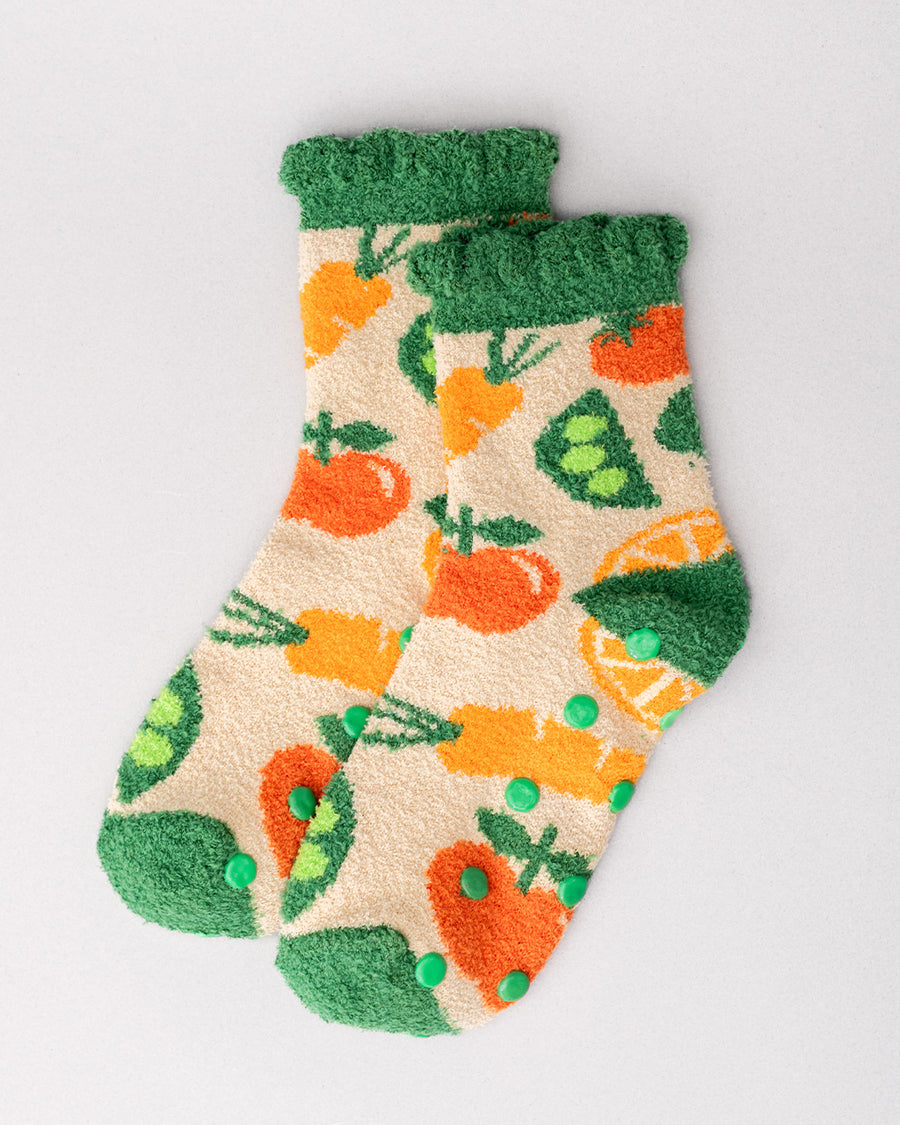 cream chenille socks with green ruffle top with all over veggie print and green grip bottom