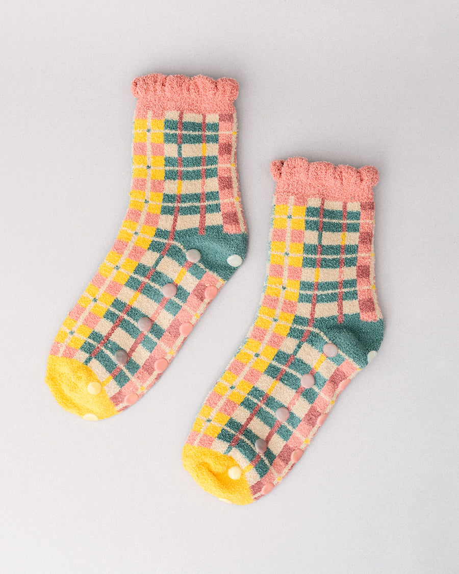 separated coral, teal, cream and yellow plaid chenille socks with coral ruffle top and cream grip bottoms