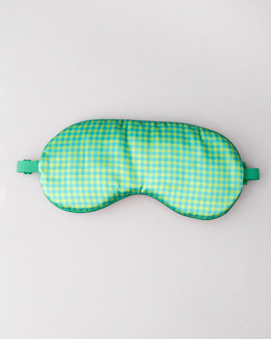 green gingham back of colorful patchwork eye mask with cream 'shhhh...can't you hear i'm snoring?' across the front