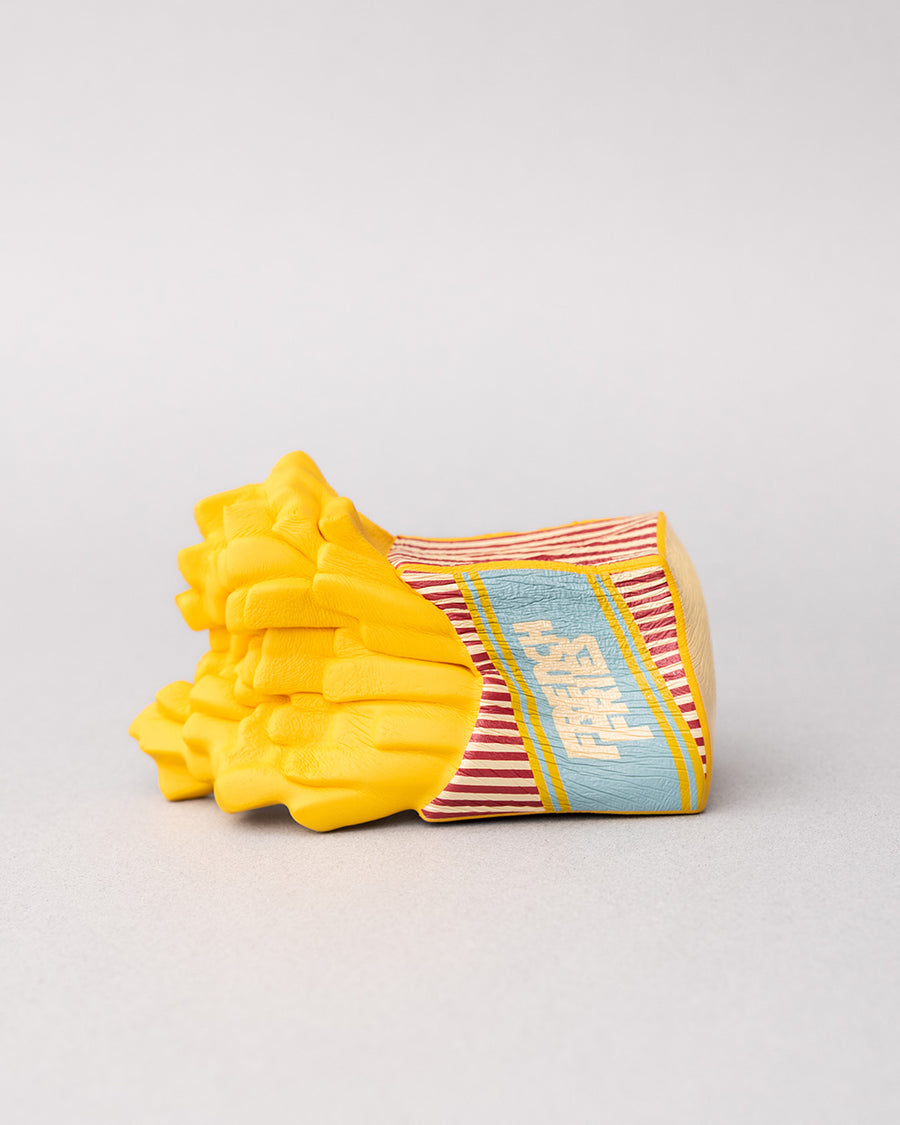 french fry shaped de-stress ball laying on it's side