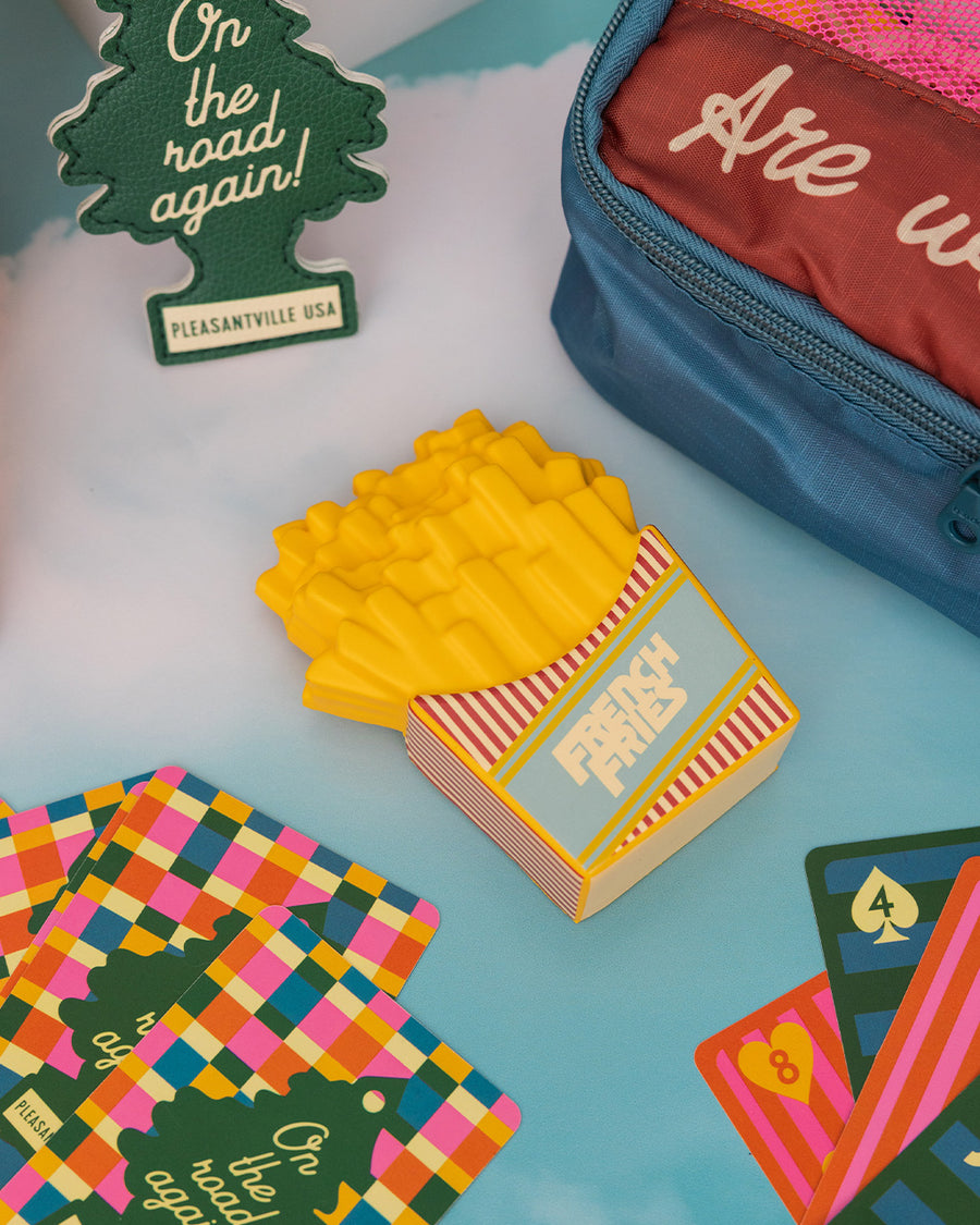 french fry shaped de-stress ball on a blue background