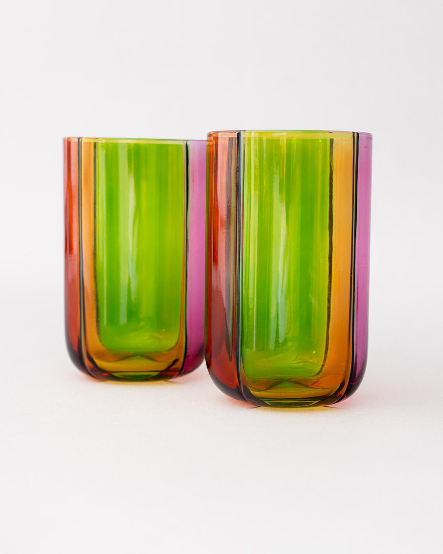 side view of set of two high ball glass set with four colors sections: pink, green, orange and red
