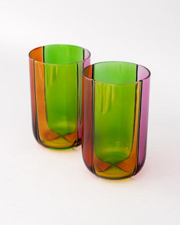 side view of set of two high ball glass set with four colors sections: pink, green, orange and red