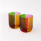 side view of set of two low ball glass set with four colors sections: pink, green, orange and red