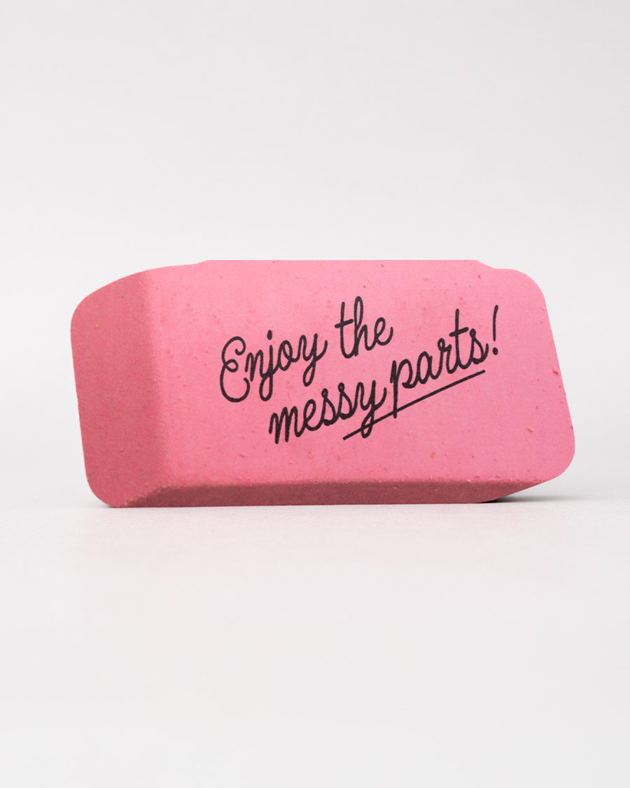 realistic eraser notepad with 'enjoy the messy parts' across the front