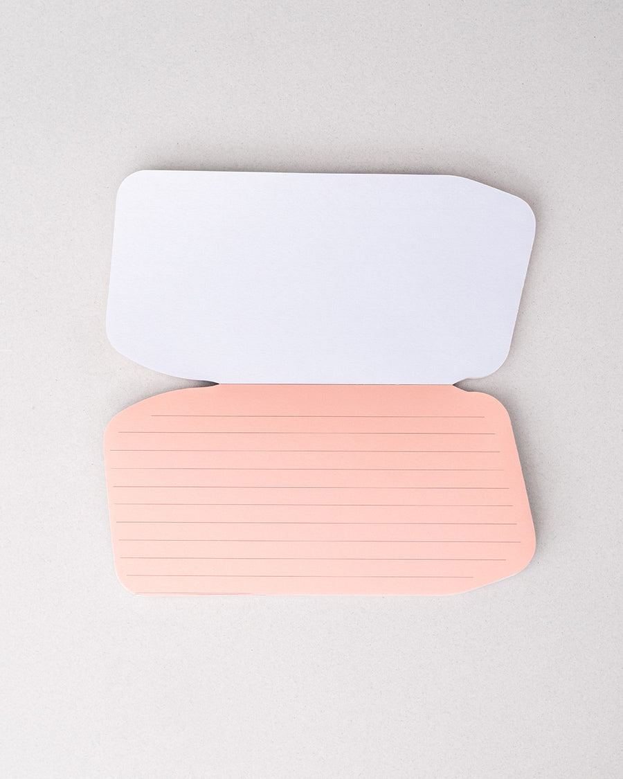 pink interior pages of realistic eraser notepad with 'enjoy the messy parts' across the front