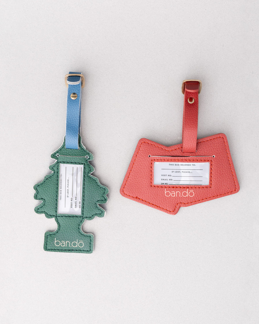 clear window back of set of 2 luggage tags: green air freshener tree with white 'on the road again! pleasantville USA and red and white double dice