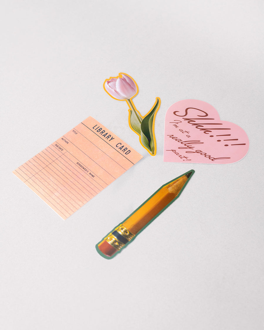 side view of set of 4 big stickers: realistic pencil, realistic pink tulip, library card, and pink heart that says 'shhh!!! i'm at a really good part!
