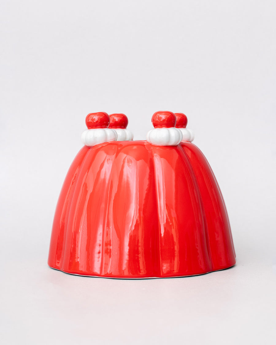 up close of red jello mold vase/planter